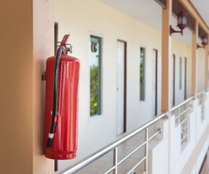 fire extinguisher hanging on a balcony