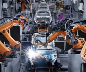 Robotic arms used in a car manufacturing factory