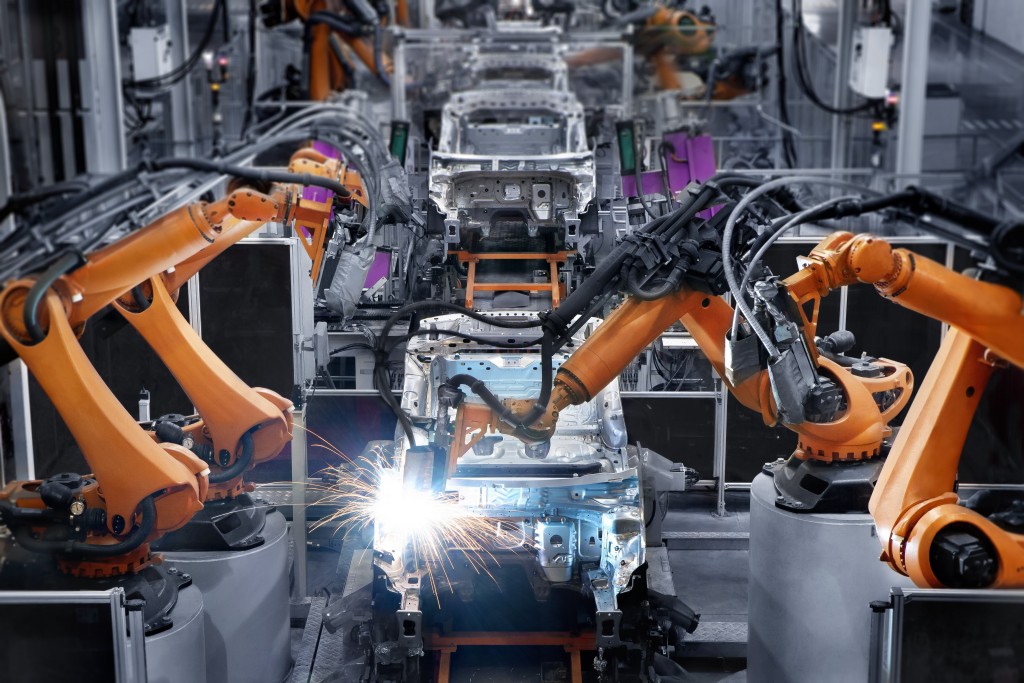 Robotic arms used in a car manufacturing factory