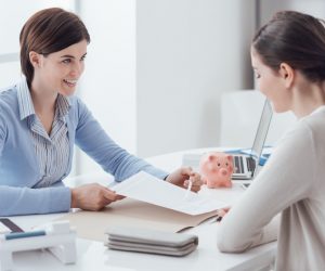 woman handing a contract to the debtor