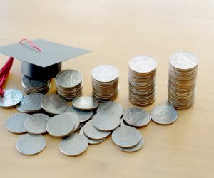 coins and small graduation cap