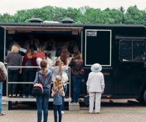 People flocking in a food truck