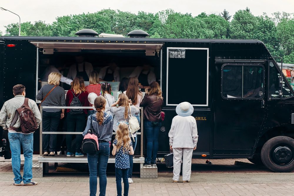 People flocking in a food truck