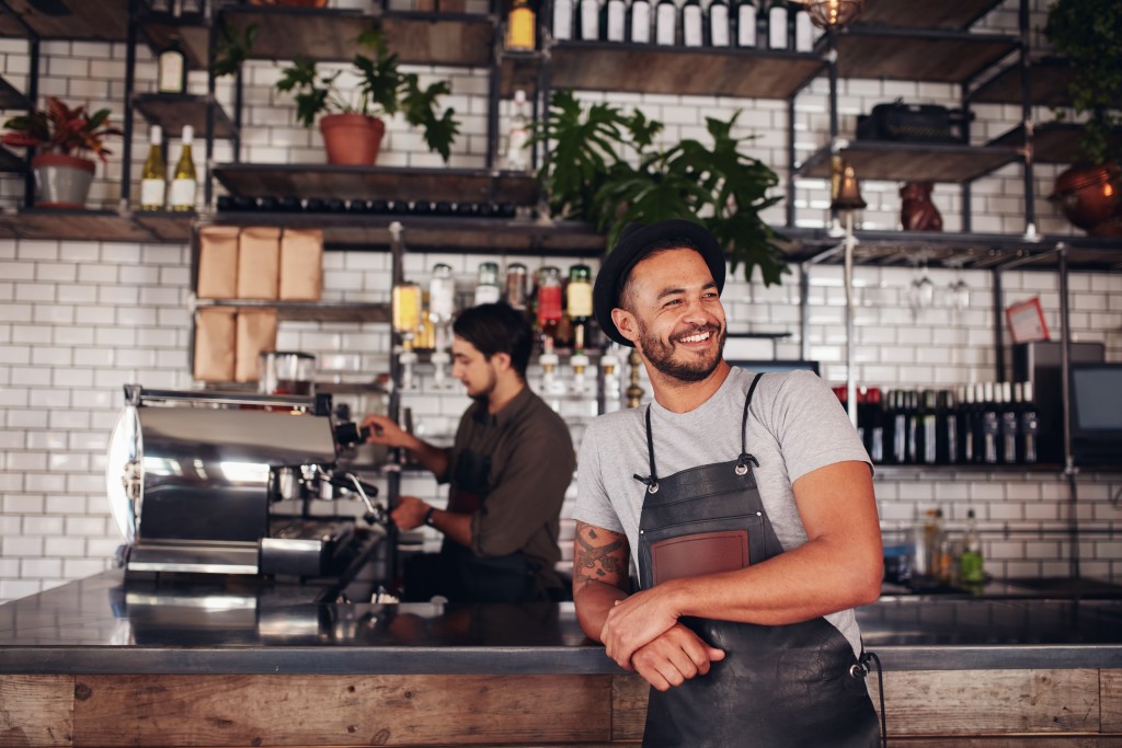 Cafe owner posing