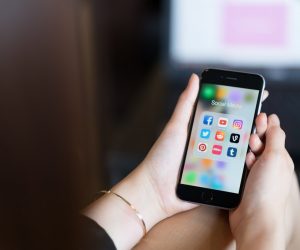 Woman hands holding a black iPhone