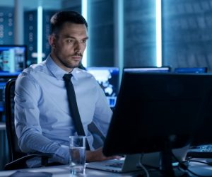 cybersecurity concept, employee working in his desktop and laptop