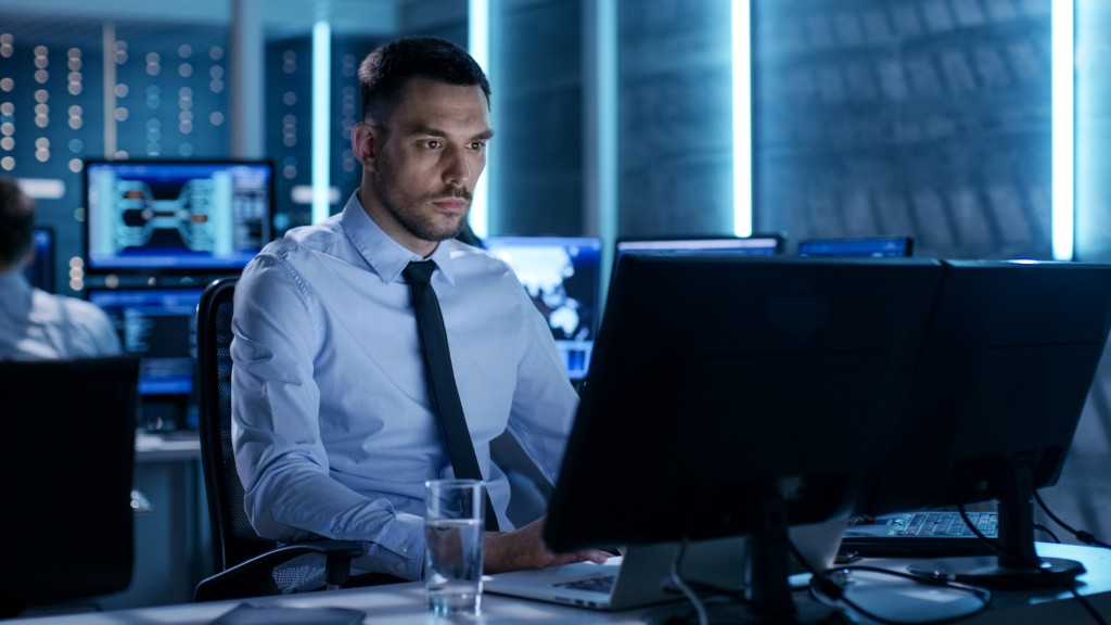 cybersecurity concept, employee working in his desktop and laptop