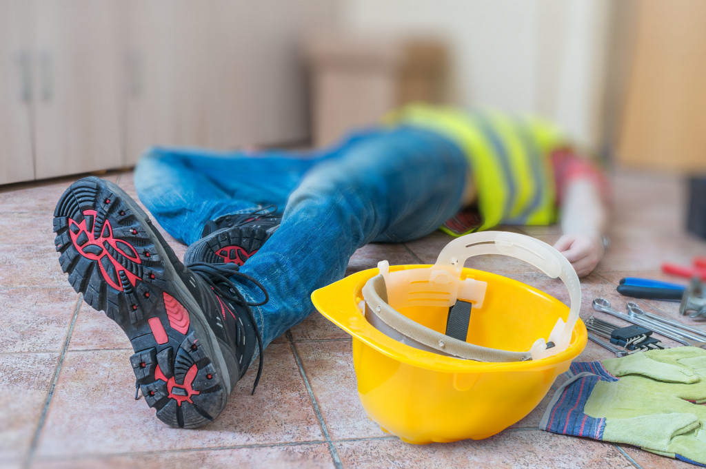 Construction worker lying on the ground