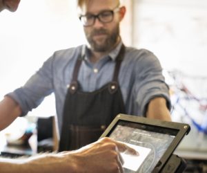 man paying at the counter