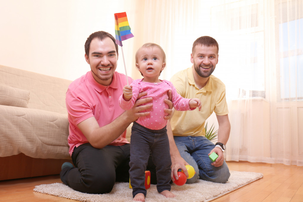 Gay couple with adopted baby