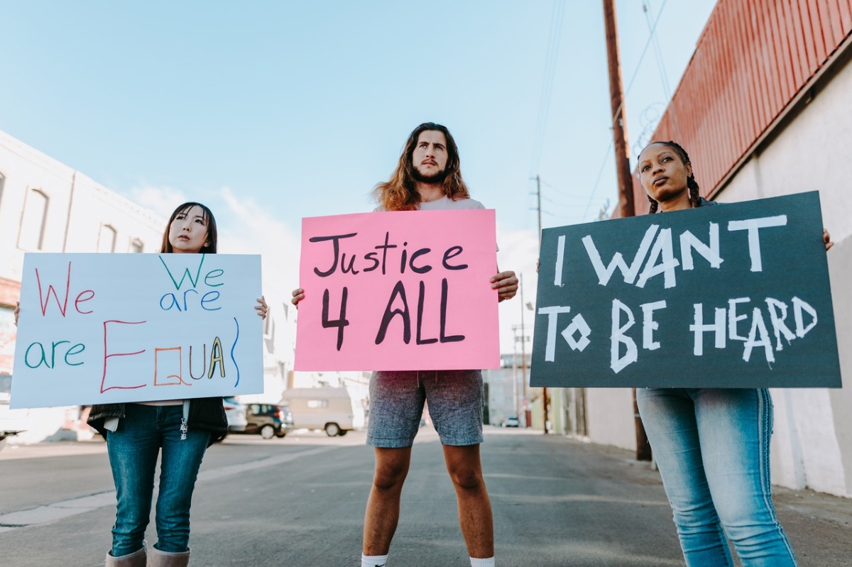 people holding signs