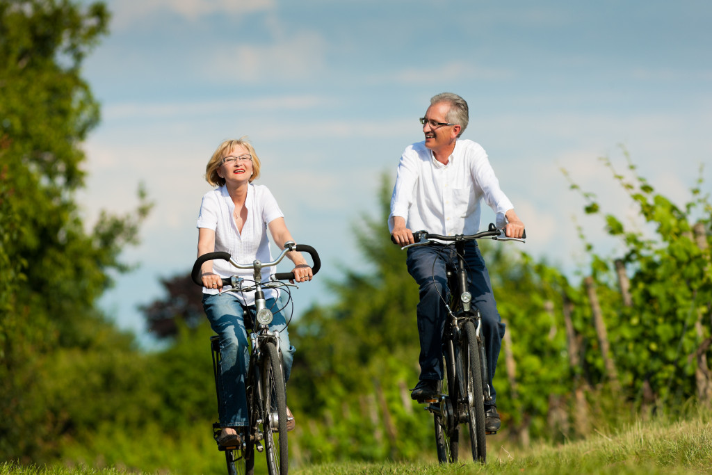 senior couple biking through the coutryside