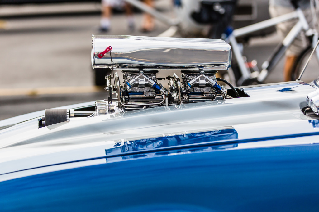 turbo charger of a car showing above the hood