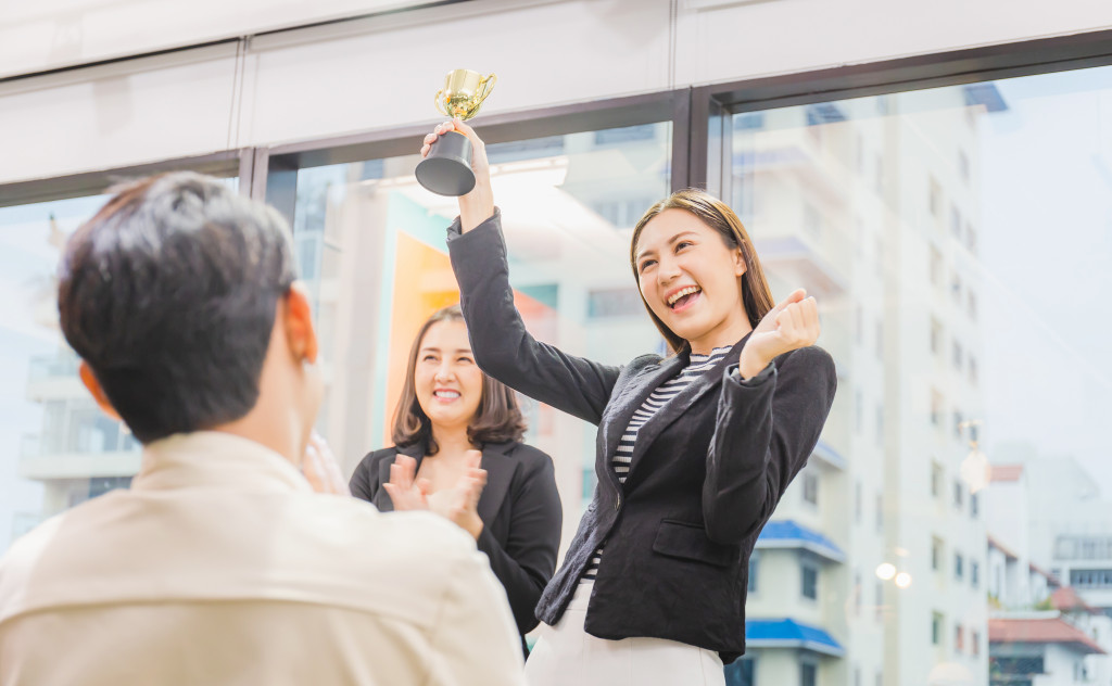 female employee receiving a reward