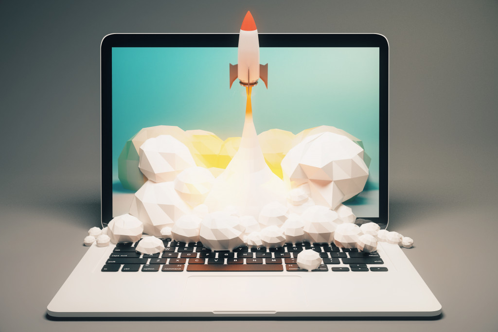 rocket launching from a laptop representing digital marketing