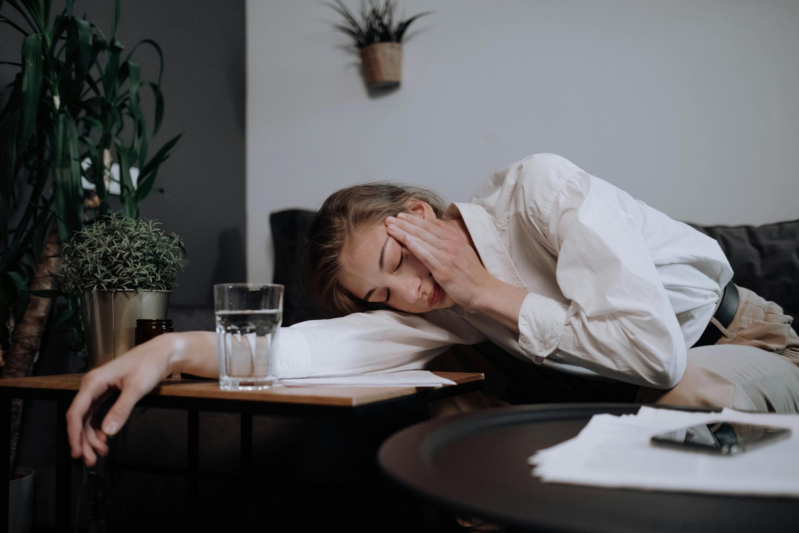 woman falling asleep on a table